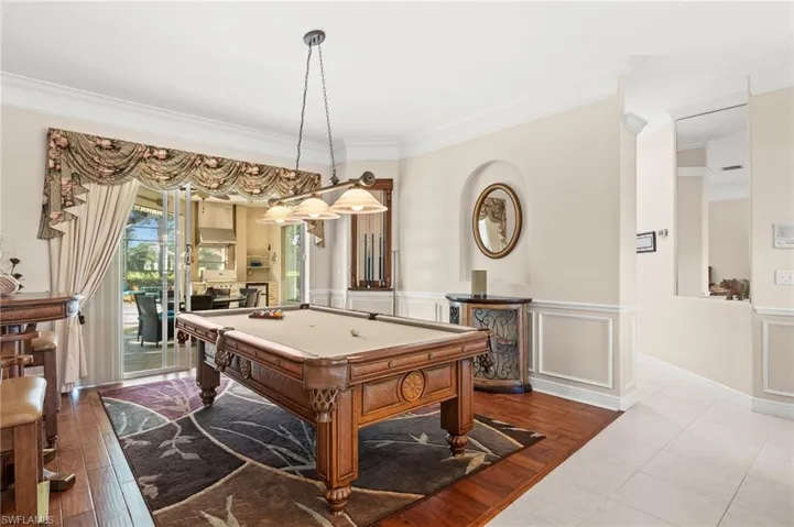 Formal living room leading to lanai and pool