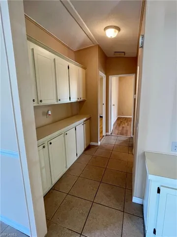 Hall featuring built in cabinets