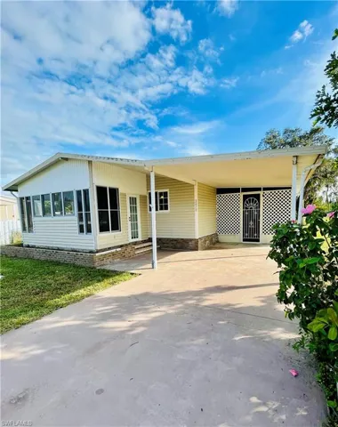 View of the front of the property featuring a carport