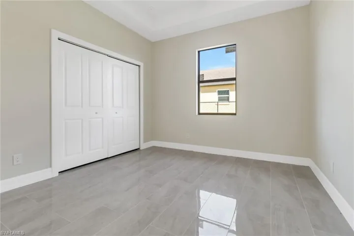 Unfurnished bedroom with a closet