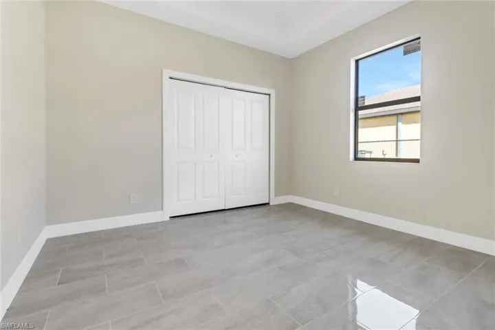 Unfurnished bedroom with a closet