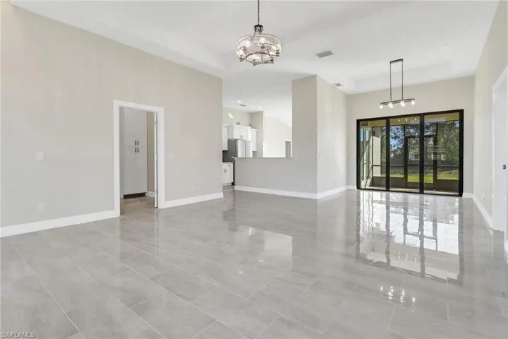 Spare room featuring a notable chandelier