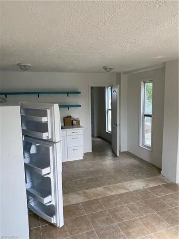 Unfurnished room with tile flooring