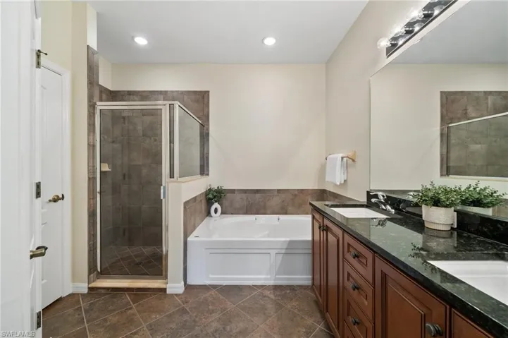 Primary Bath with Dual Sinks, Soaking Tub and Beautiful Glass-Walled Shower