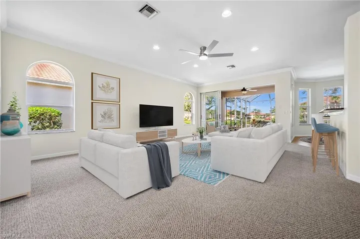 Living Room looking towards Lanai and Pool area *Virtually Staged