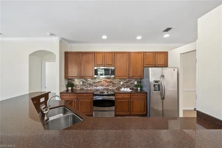 Granite Countertops and Tile Backsplash in the Kitchen