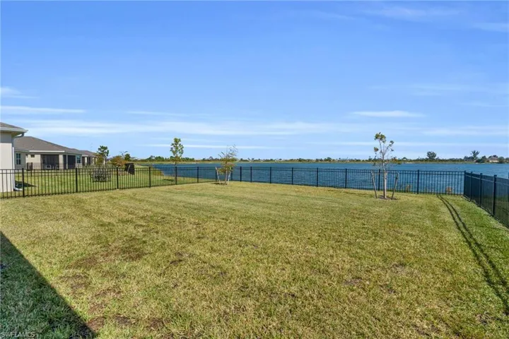View of yard with a water view