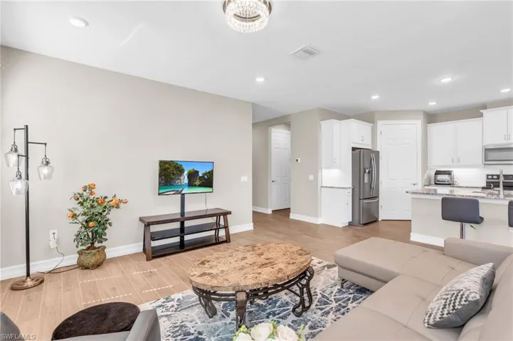 Living room with light hardwood / wood-style flooring
