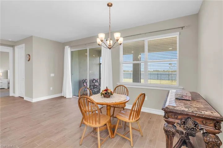 Dining room featuring a chandelier and light hardwood / wood-style flooring