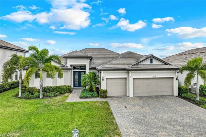19437 The Place Blvd home has a 3 car garage with and extra long driveway for your guests.
