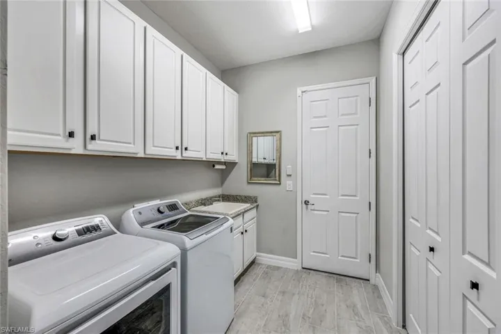 TON'S of Laundry space, cabinetry and closet space!