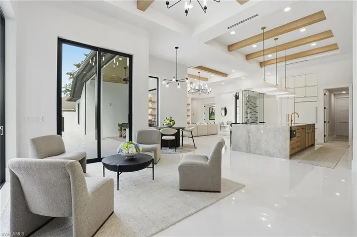 Building lobby with beamed ceiling and recessed lighting