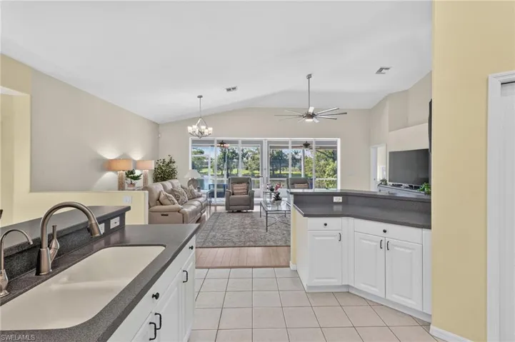Kitchen and view of Living Room, Lanai and Lake
