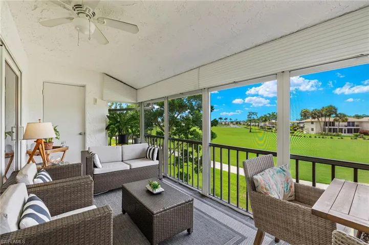 Sunroom with ceiling fan and lofted ceiling