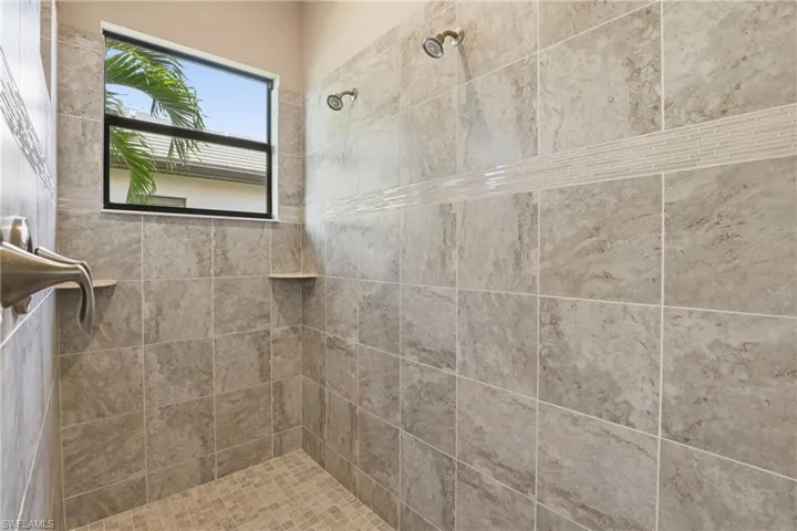 Bathroom featuring tiled shower