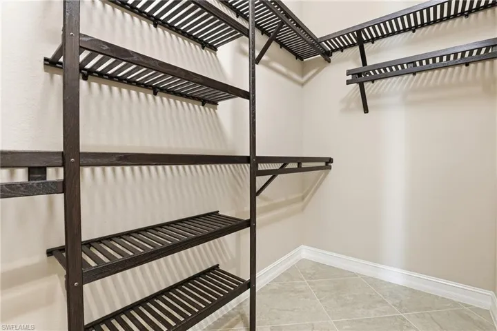 Walk in closet featuring light tile patterned floors