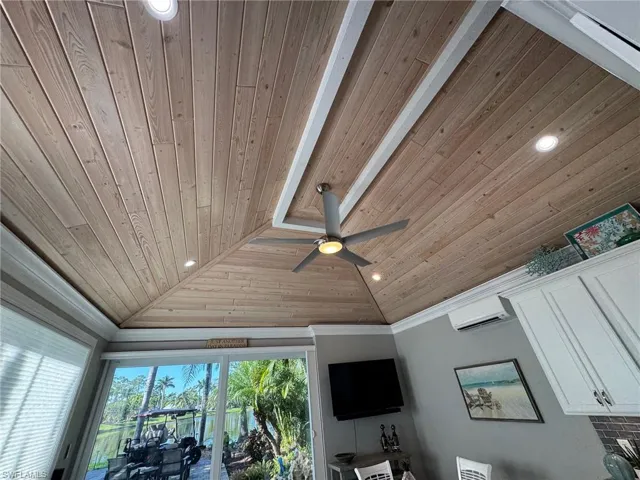 Details with wood ceiling, beamed ceiling, a wall mounted air conditioner, crown molding, and ceiling fan