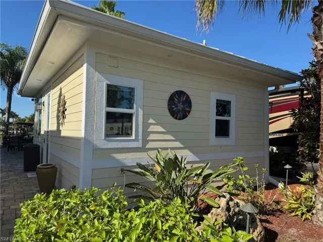 View of side of property with a patio area