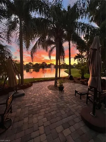 Patio terrace at dusk with a water view