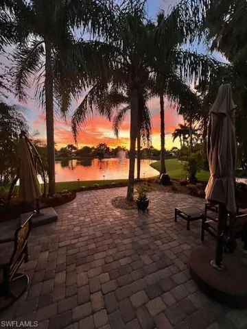Patio terrace at dusk with a water view
