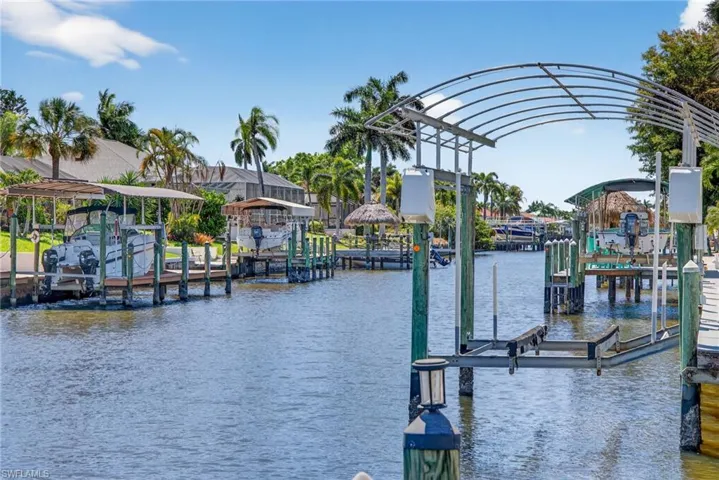 Dock with a water view and boat lift