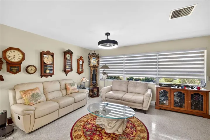 Living room featuring speckle patterned floor