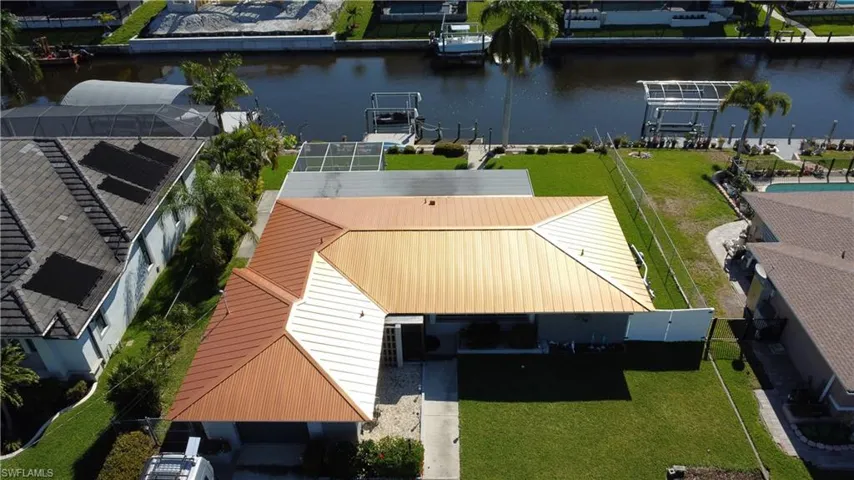 Aerial view of residential area with a nearby body of water