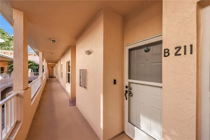 Entrance to property featuring stucco siding