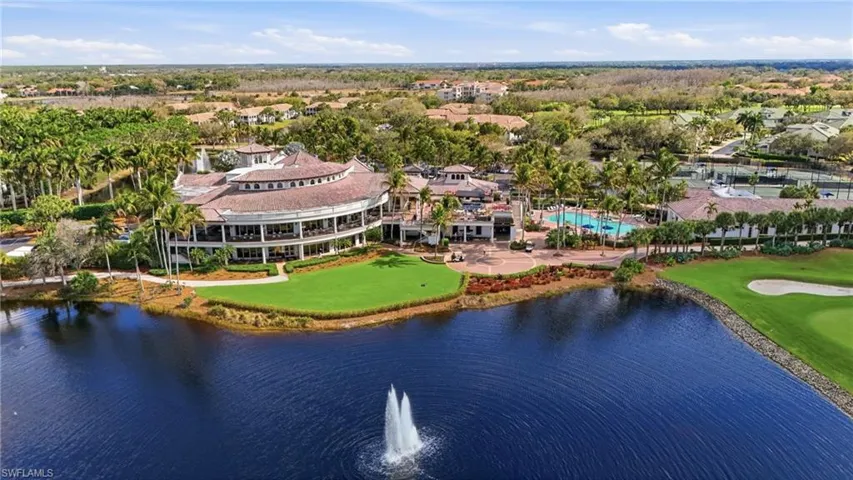 Picturesque waterfront clubhouse with water feature