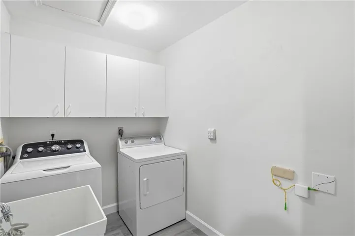 Wash tub with storage above washer/dryer