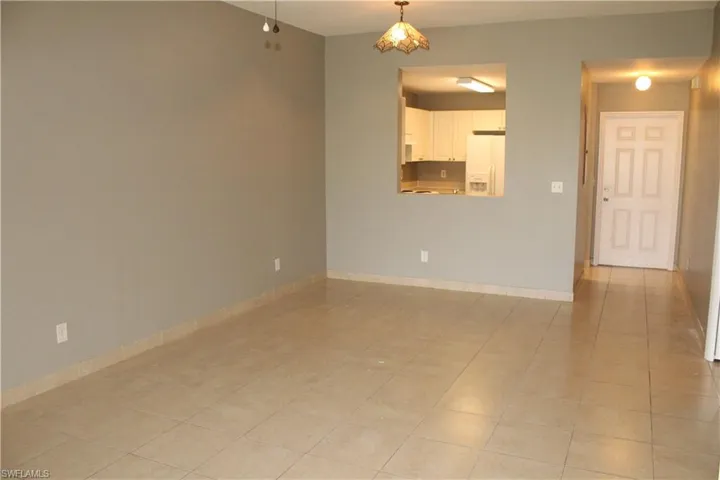 Empty room featuring light tile patterned floors