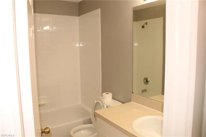 Full bath with shower / bathtub combination and vanity