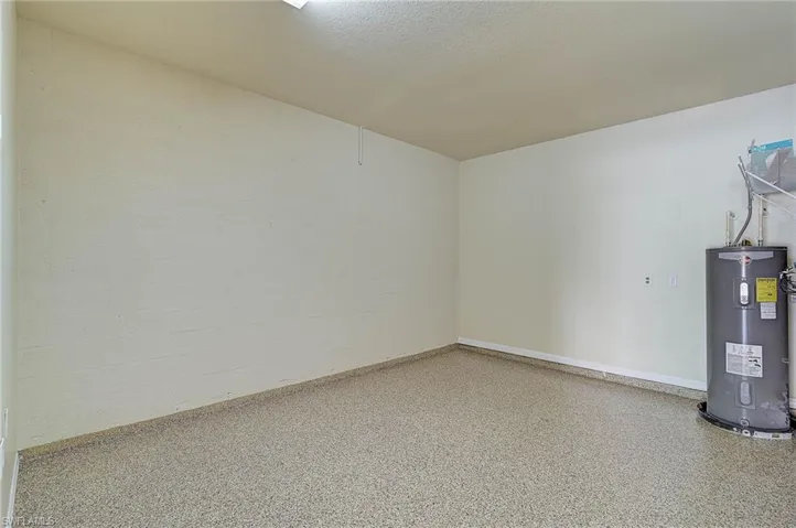 Basement featuring water heater