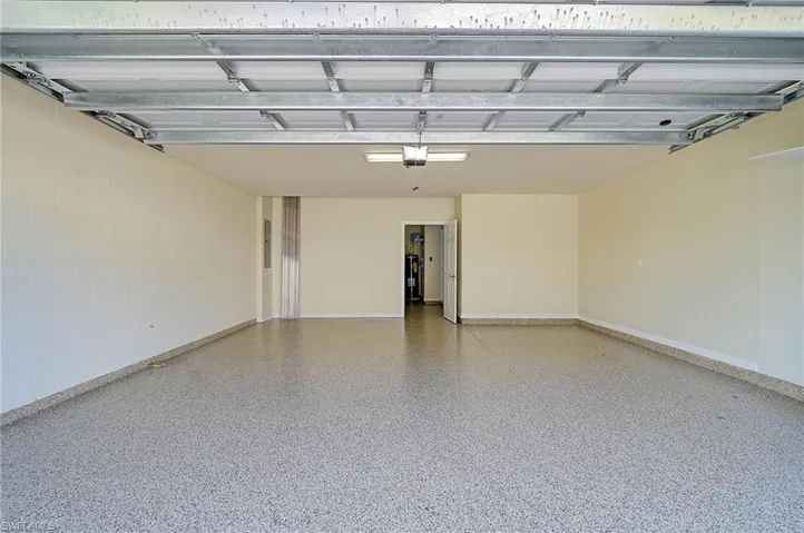 Garage featuring a garage door opener