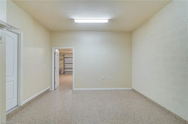 Spare room featuring a textured ceiling
