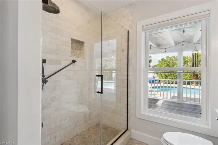 Bathroom with an enclosed shower and toilet
