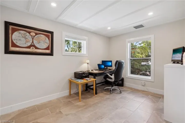 Tiled office space with a wealth of natural light