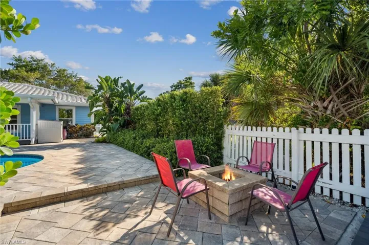 View of patio with a fire pit