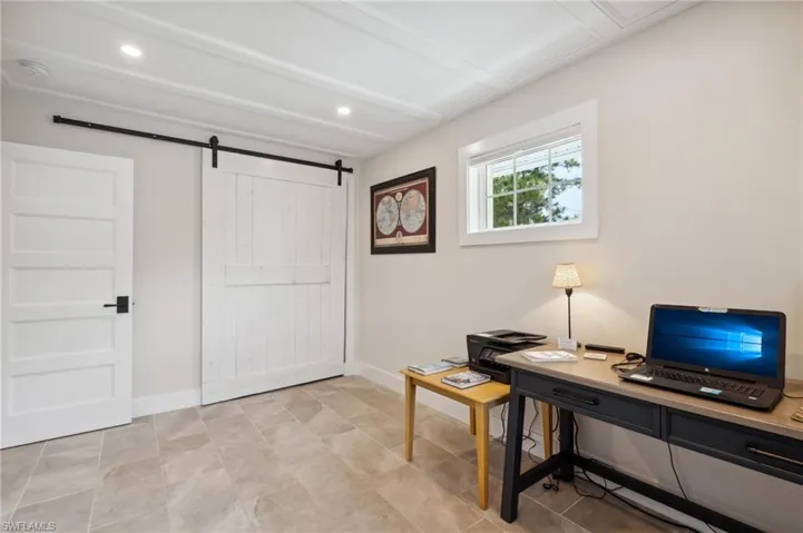 Office area featuring a barn door