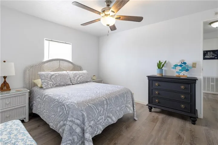 Bedroom featuring wood finished floors and ceiling fan