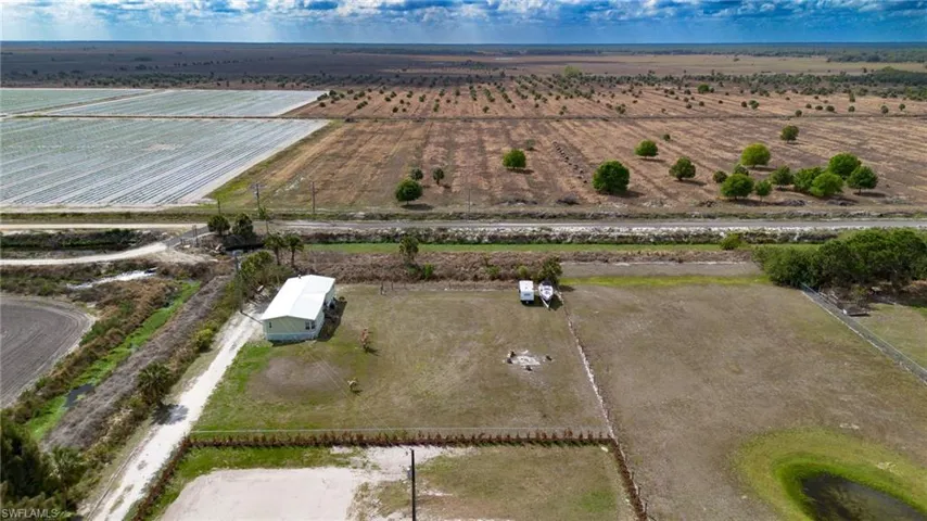 Aerial view of sparsely populated area featuring extensive farmland