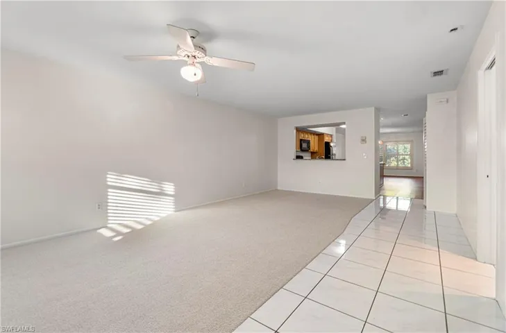 Large living room with passthrough to kitchen
