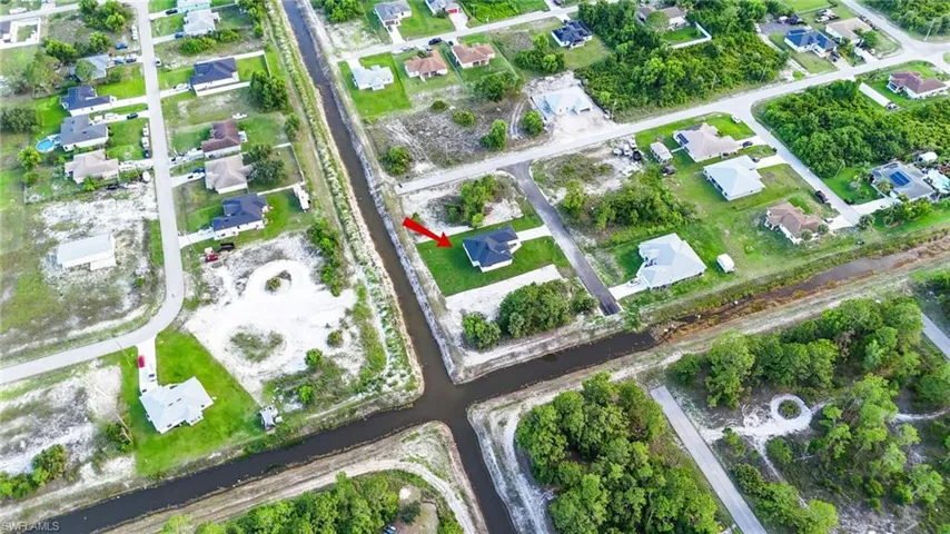 View of property location with nearby suburban area