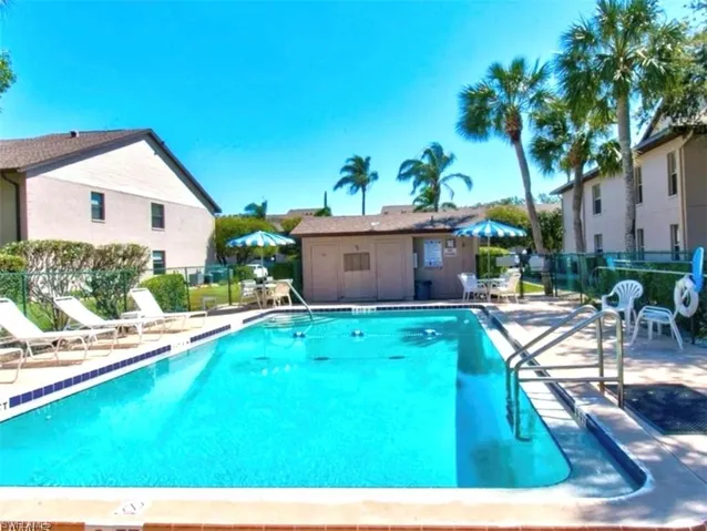 Community pool with a patio