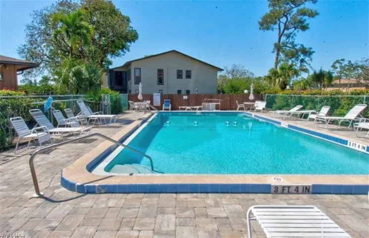 Community pool with a patio area