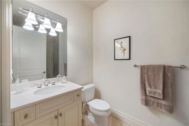 Full bathroom featuring vanity and tiled shower