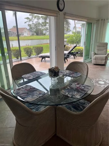 Expansive patio with sliding glass doors and a water feature