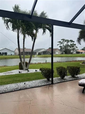 beautiful screened lanai overlooking a fountained pond