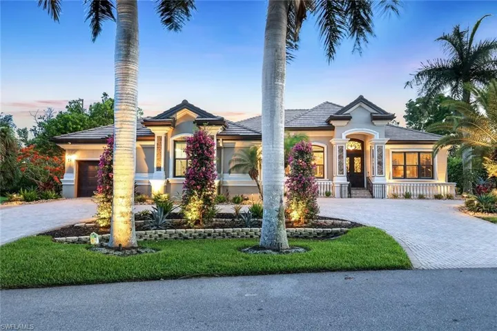 Welcome home! Beautiful new landscaping and professional landscape lighting.