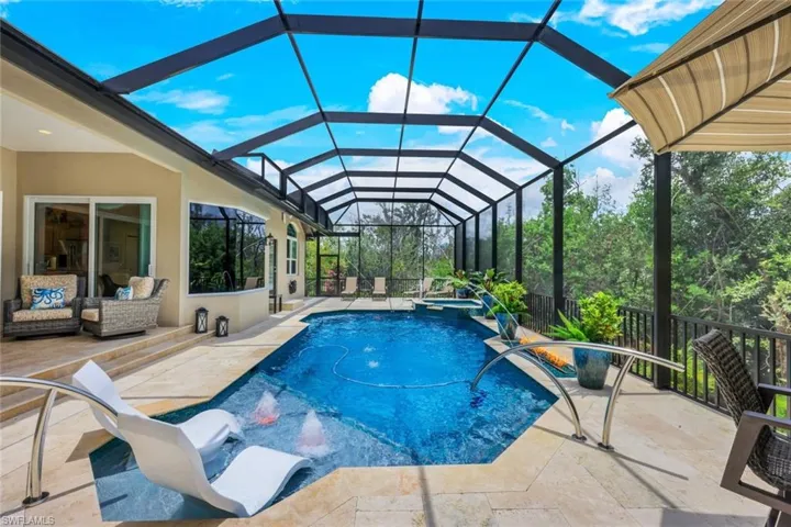 View of pool featuring a patio and a lanai